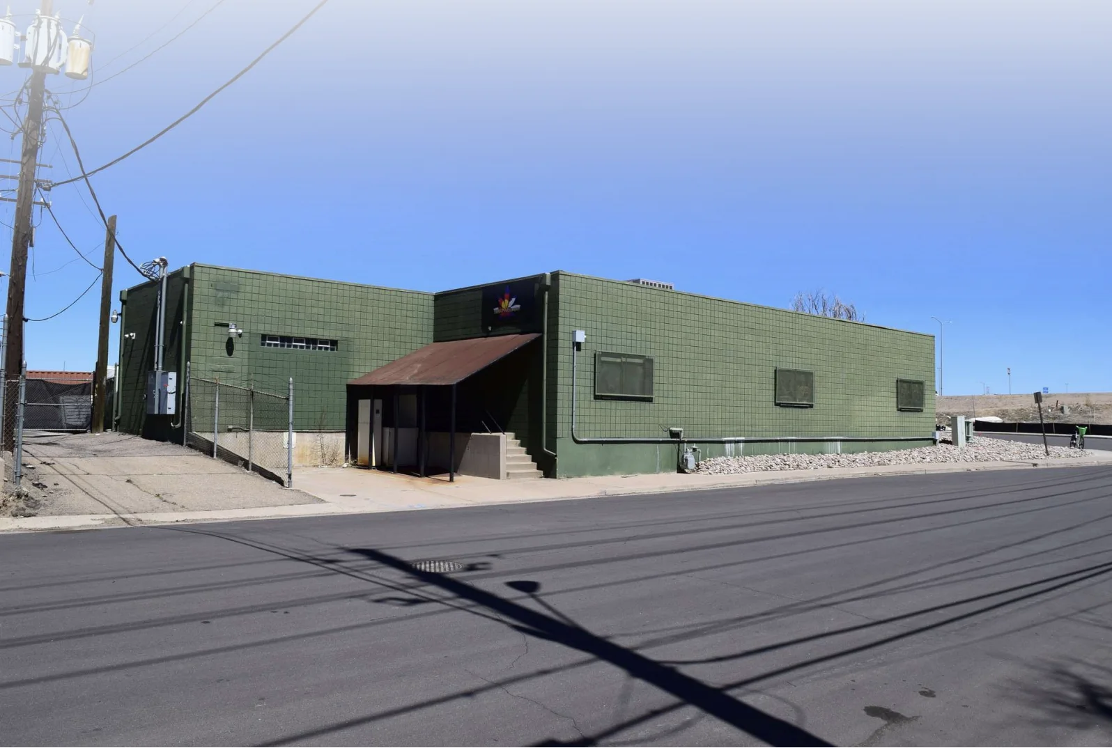 Industrial office warehouse Denver sold for $850,000 at 3895 E 45th Avenue, featuring office space and drive-in access.