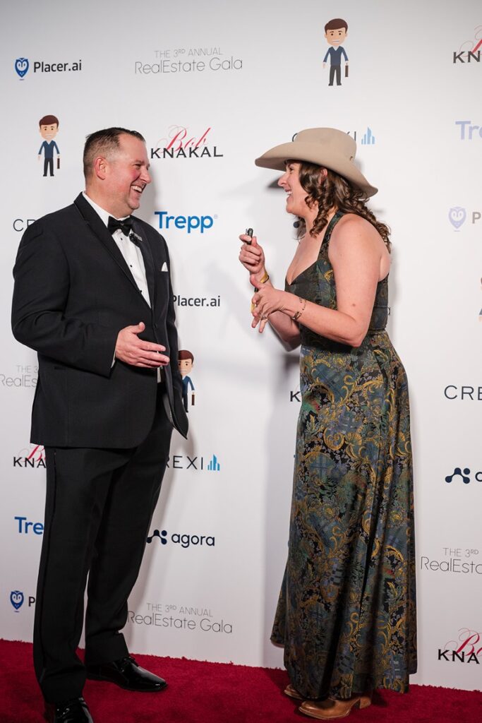 Aviva being interviewed on the red carpet at the Real Estate X Gala of StripMallGuy