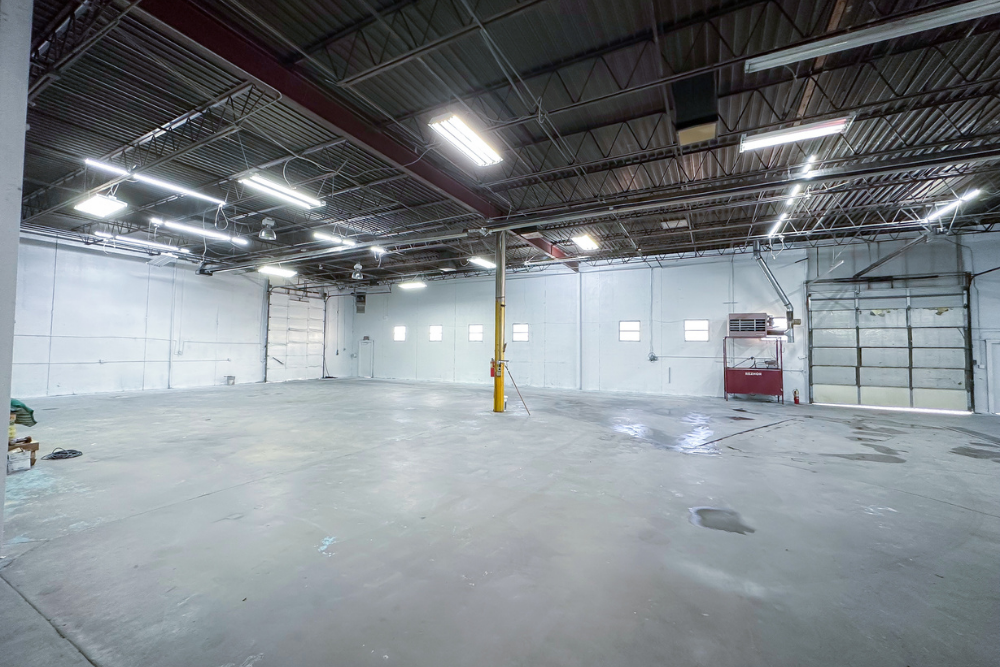 Commerce City warehouse for lease with fenced yard, office space, and drive-in access