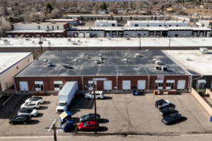 Warehouse for lease in Denver flex-industrial property with dock-high loading and office space.